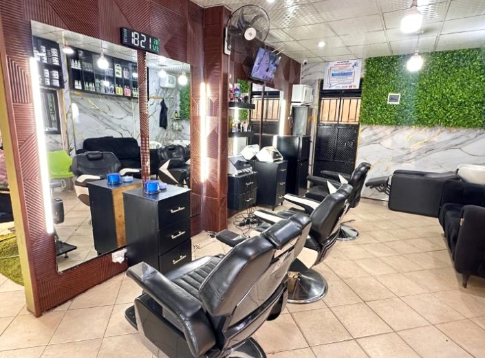 Men's grooming lounge interior, wide view